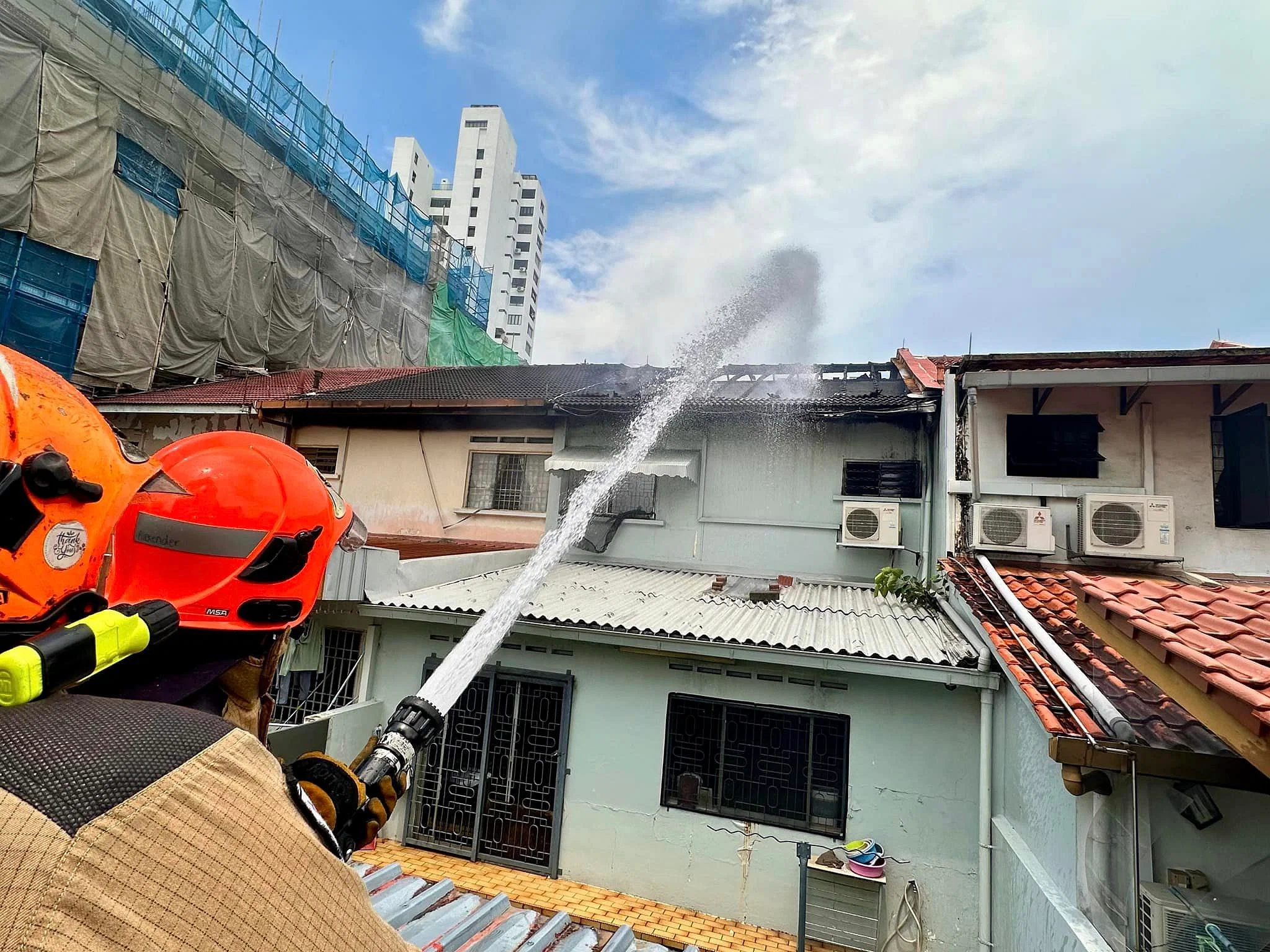 A terrace house in Katong is destroyed by fire, and two nearby units are also affected