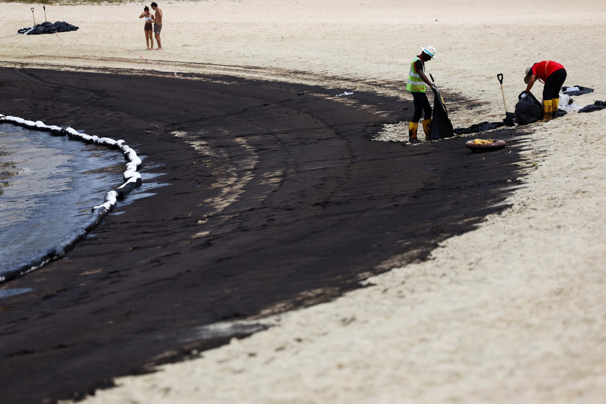 Sentosa Deploys 100 Workers To Intensify Beach Clean-up After Oil Spill 