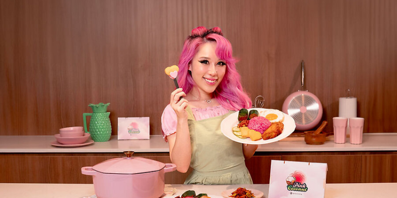 Singaporean influencer Xiaxue makes a flavorful entrance into the culinary scene by launching her own Pink Nasi Lemak brand, complete with a heart-shaped fish cake